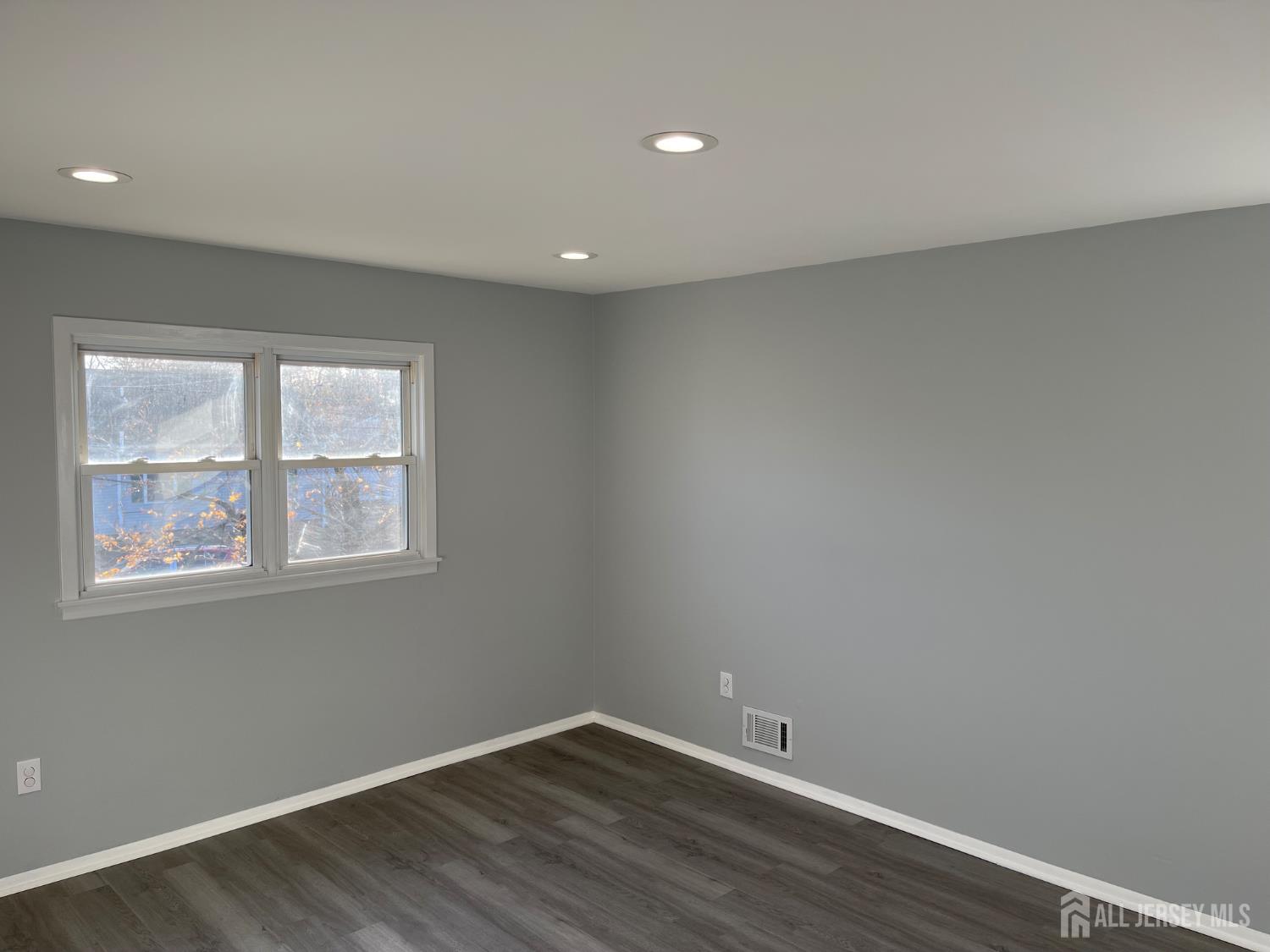 57 Greenbrook Road Middlesex, NJ 08846 - Photo 15 of 18 wooden floor in an empty room with a window