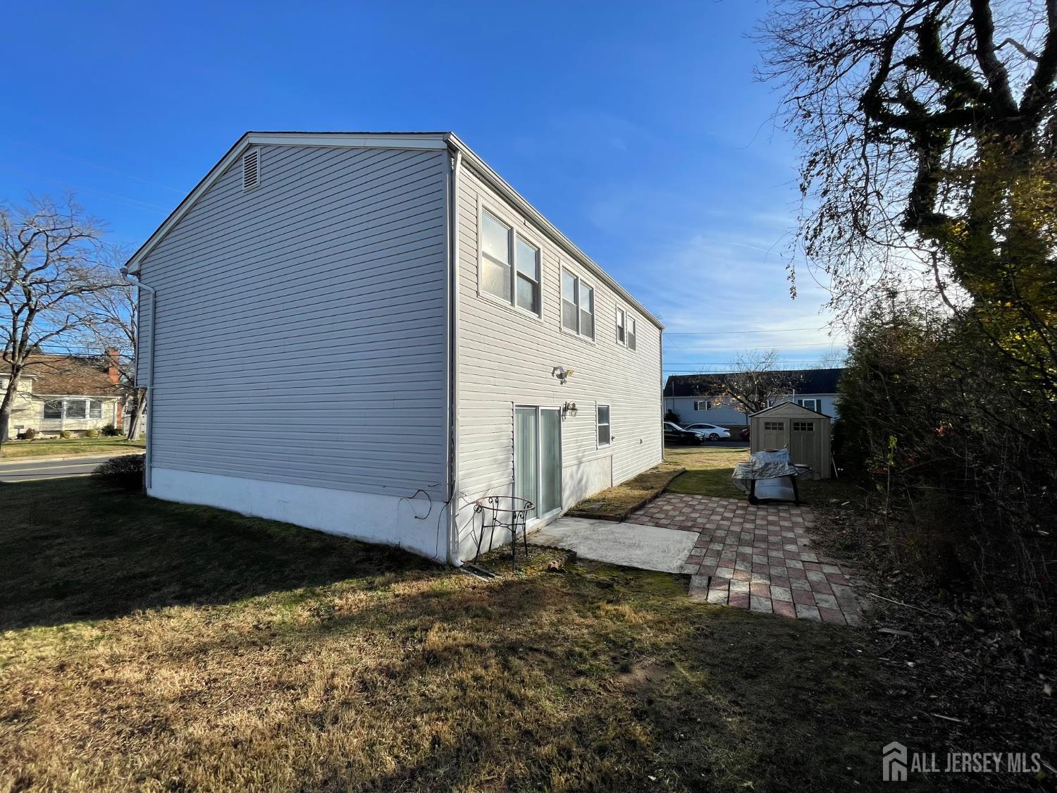 57 Greenbrook Road Middlesex, NJ 08846 - Photo 17 of 18 a view of a house with backyard and trees