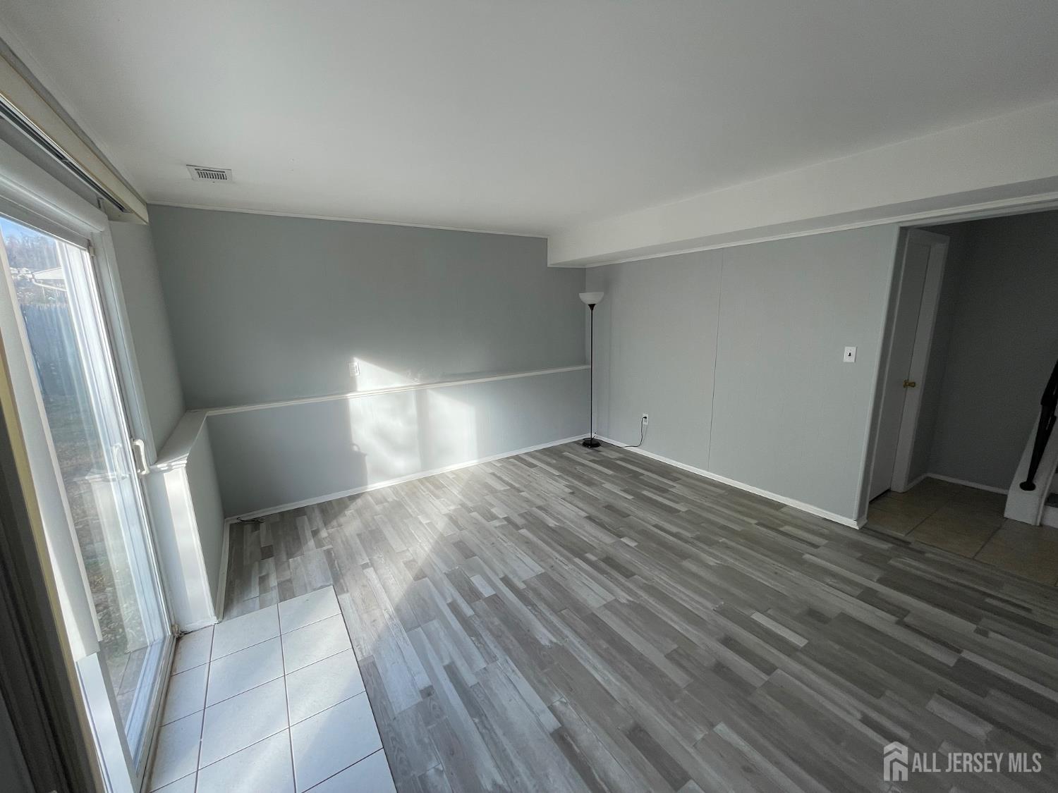 57 Greenbrook Road Middlesex, NJ 08846 - Photo 4 of 18 a view of empty room with wooden floor