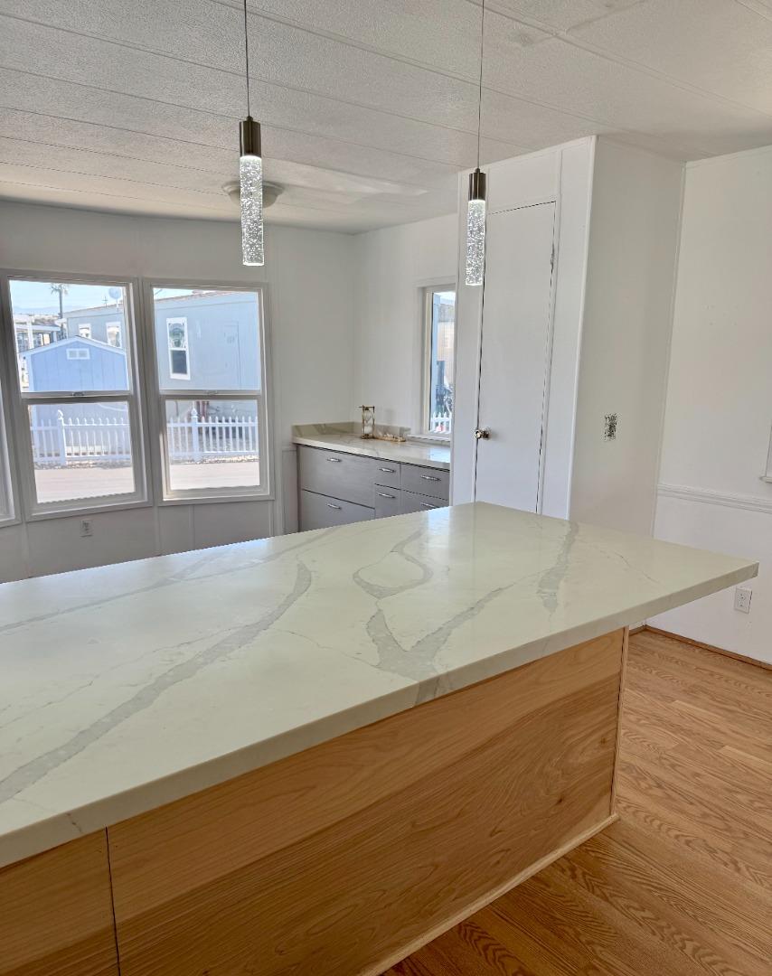 12350 Christensen Road, Unit 76 Salinas, CA 93907 - Photo 3 of 19 a view of a kitchen cabinets and wooden floor