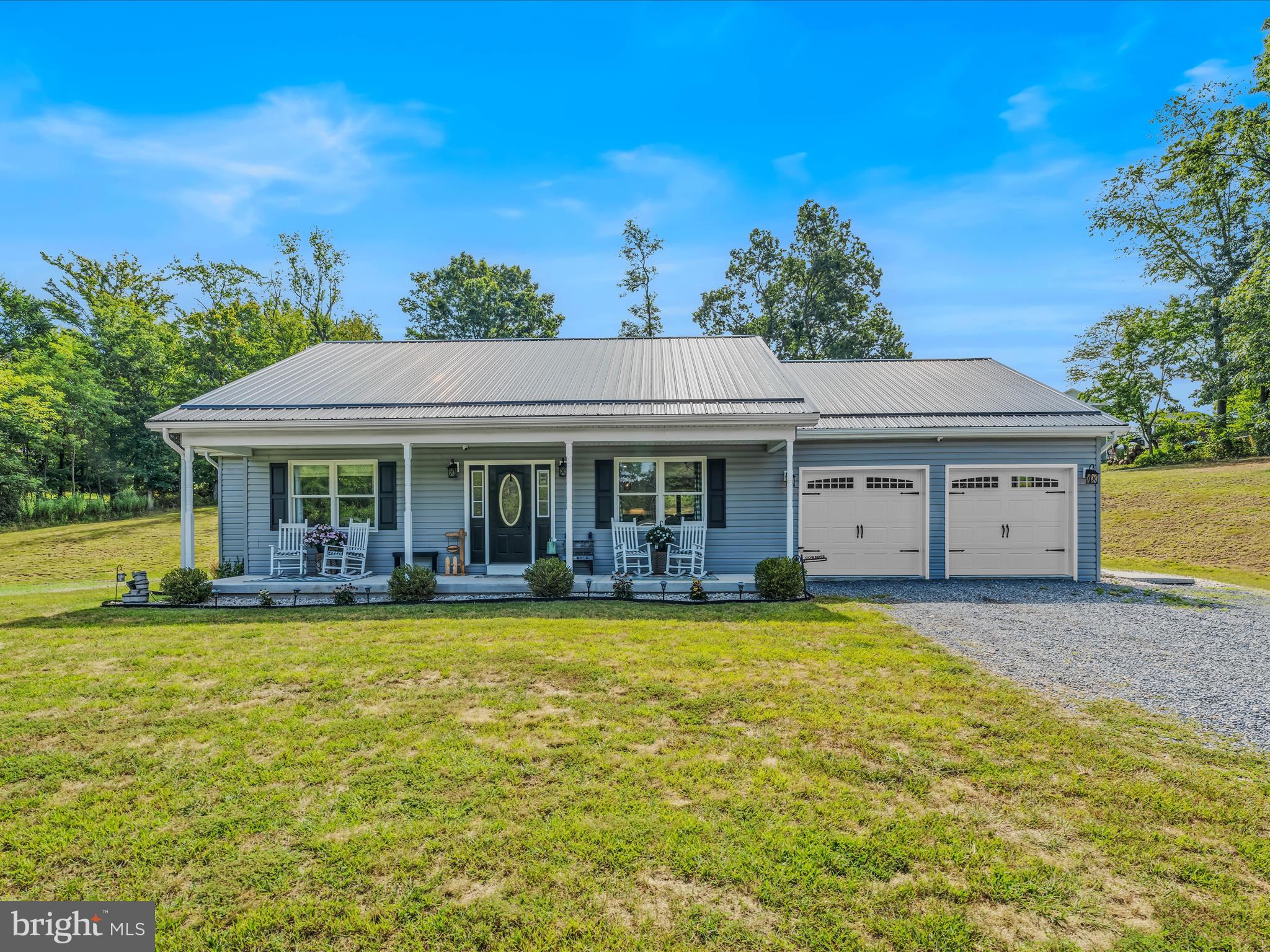 a view of a house with swimming pool and a yard