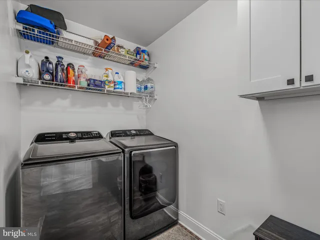 a close up of a utility room with washer and dryer