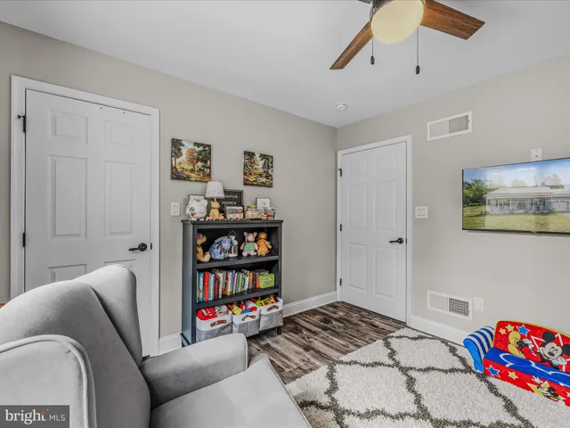 a bedroom with a bed and a book shelf