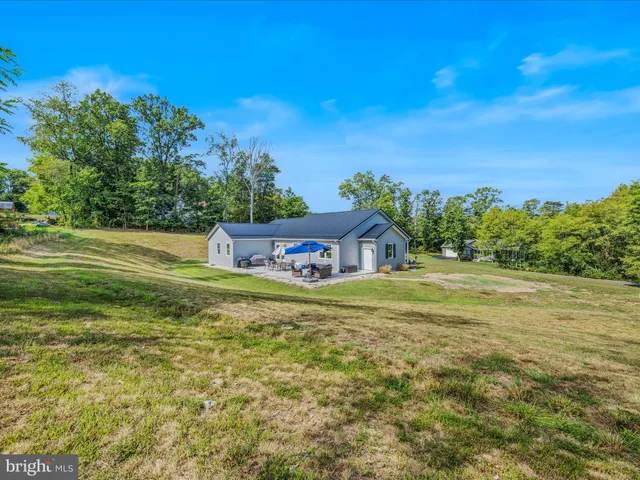 a view of a big yard with a garden
