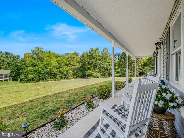 a view of an outdoor space with garden and patio
