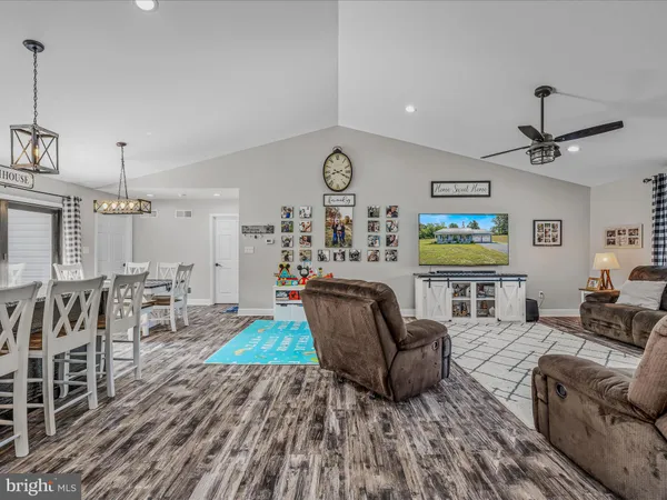 a living room with furniture and a clock