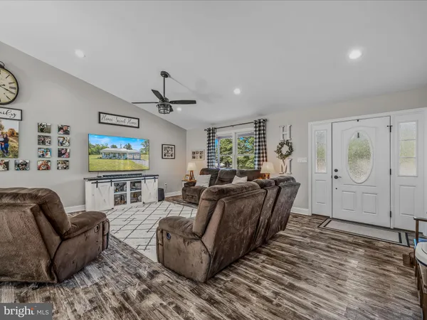 a living room with furniture and a window