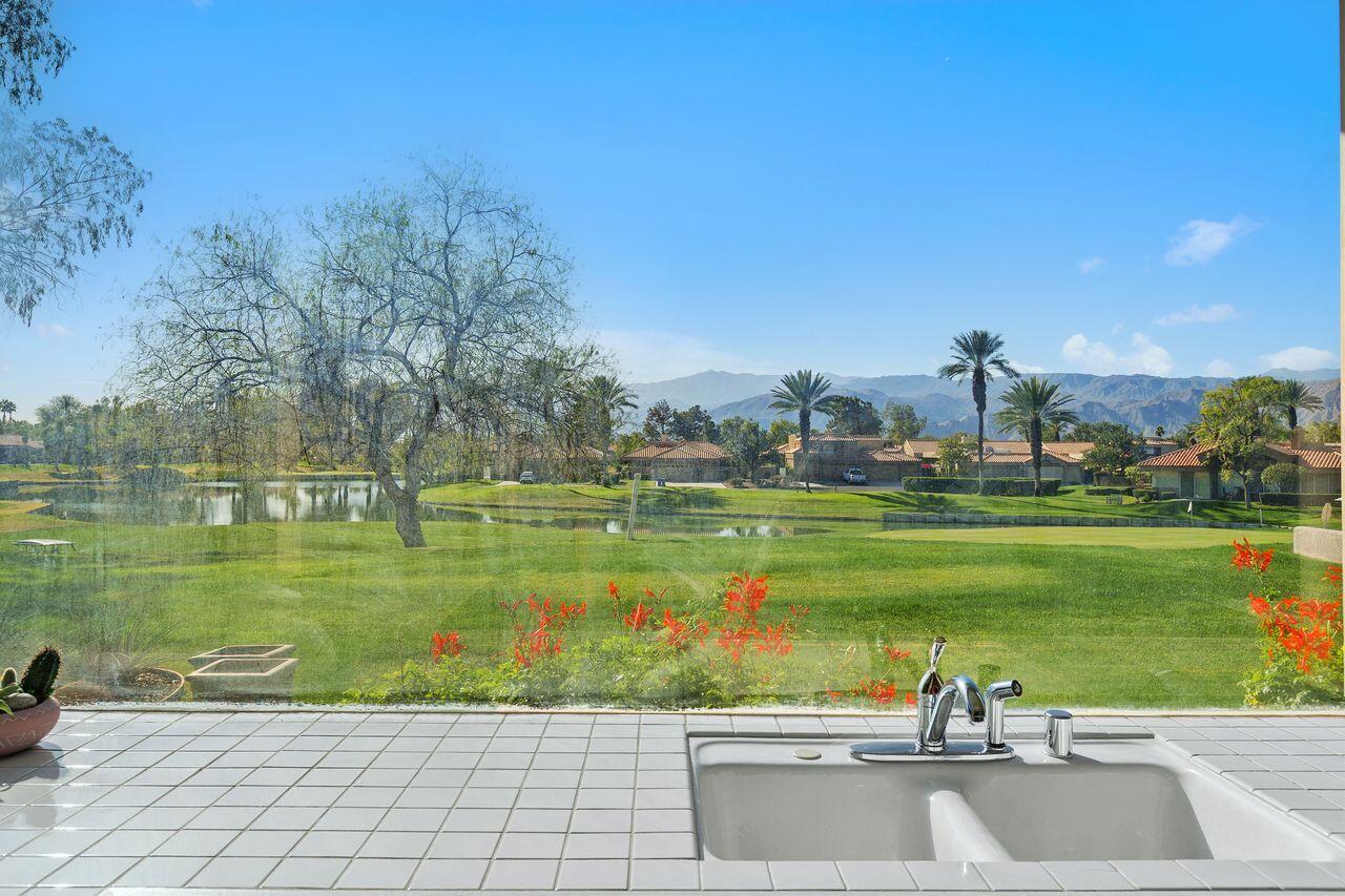 31 Pebble Beach Drive Rancho Mirage, CA 92270 - Photo 11 of 49 a view of a lake with a beach