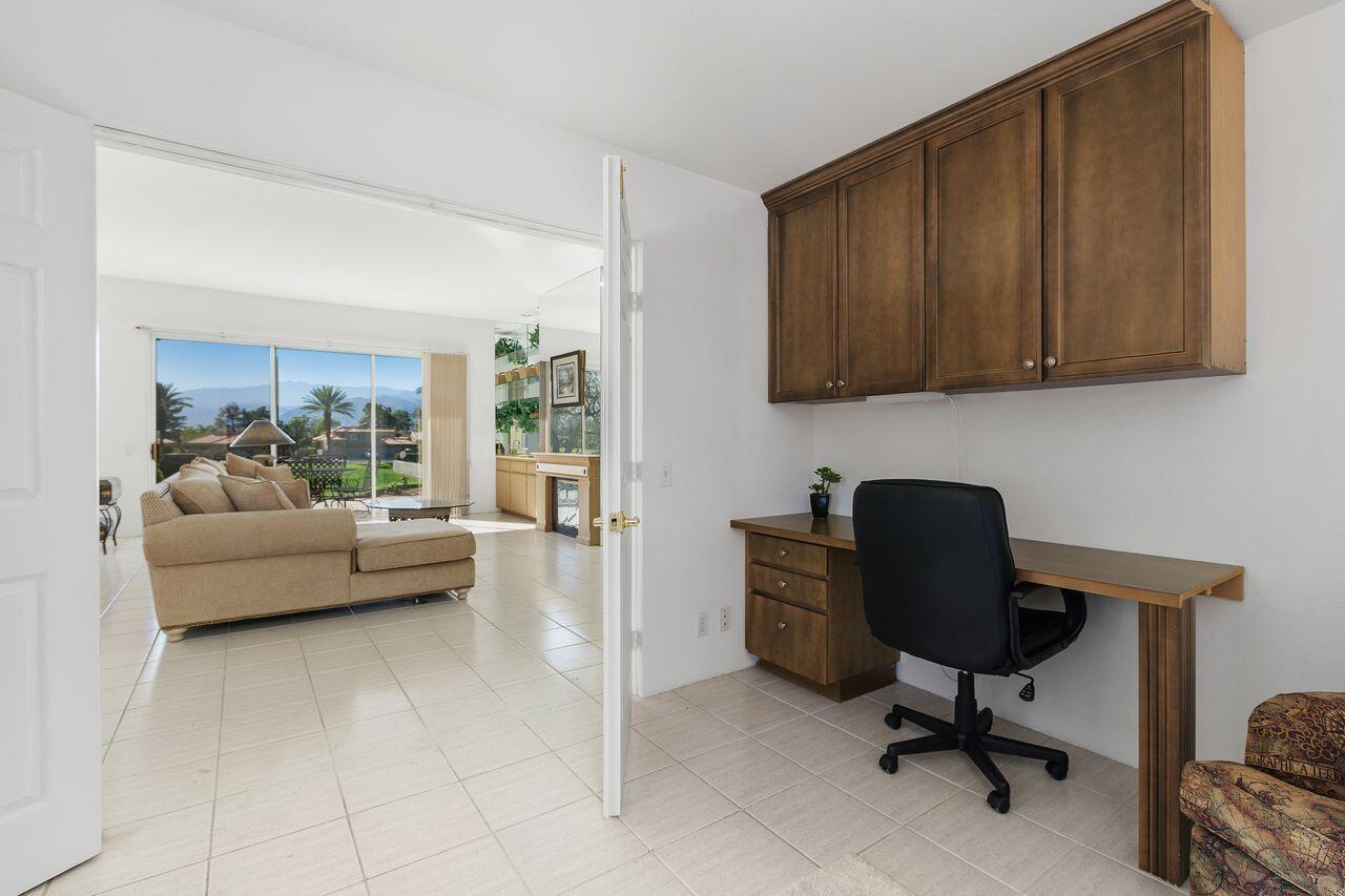 31 Pebble Beach Drive Rancho Mirage, CA 92270 - Photo 25 of 49 a living room with furniture and a workspace