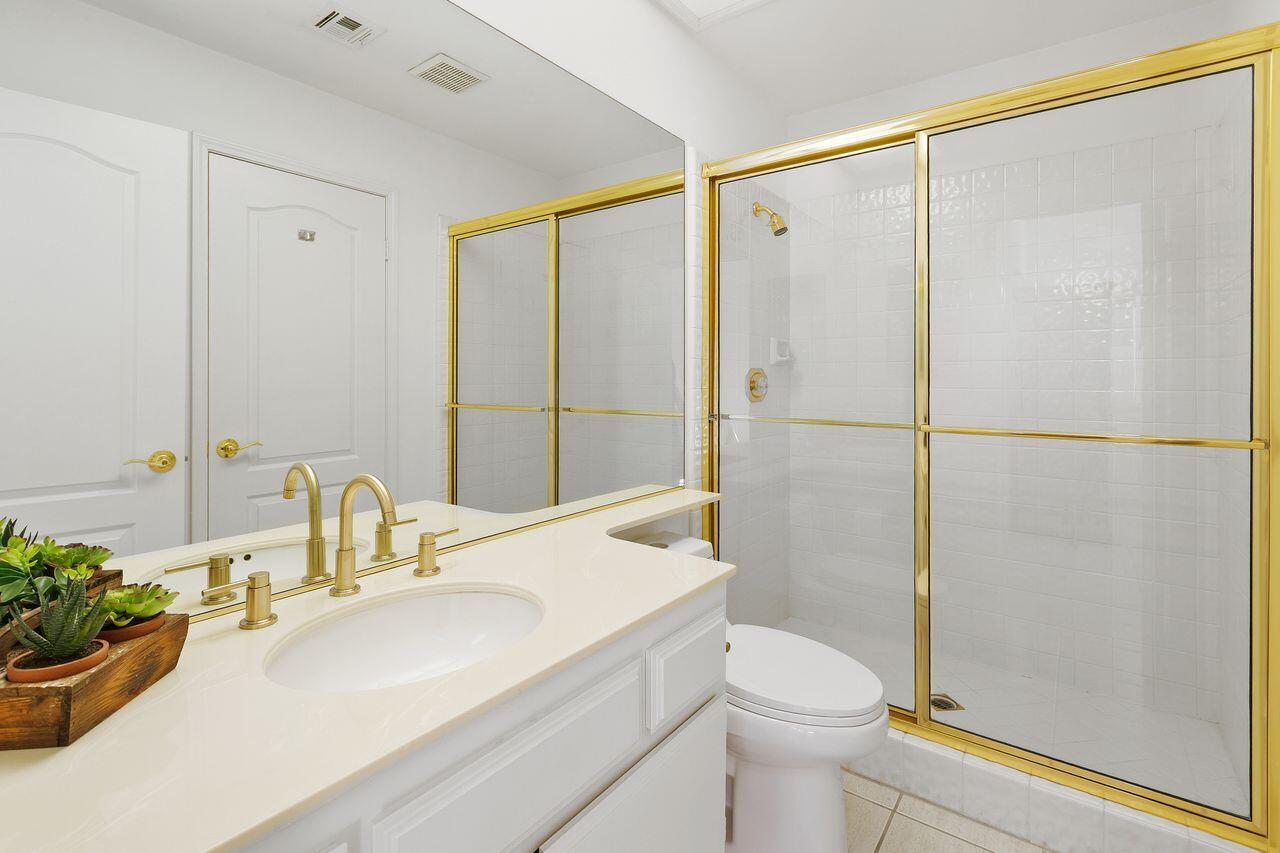 31 Pebble Beach Drive Rancho Mirage, CA 92270 - Photo 26 of 49 a bathroom with a sink a toilet and shower