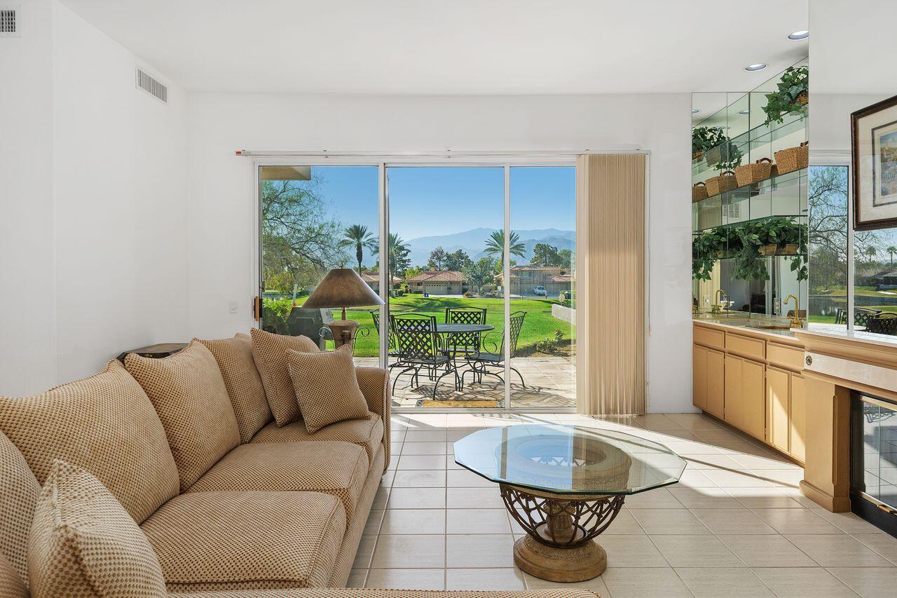 31 Pebble Beach Drive Rancho Mirage, CA 92270 - Photo 8 of 49 a living room with furniture and a large window