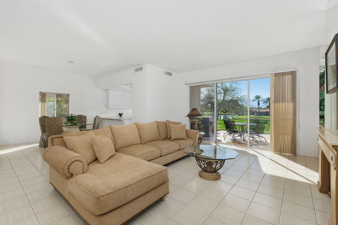 31 Pebble Beach Drive Rancho Mirage, CA 92270 - Photo 9 of 49 a living room with furniture and a floor to ceiling window