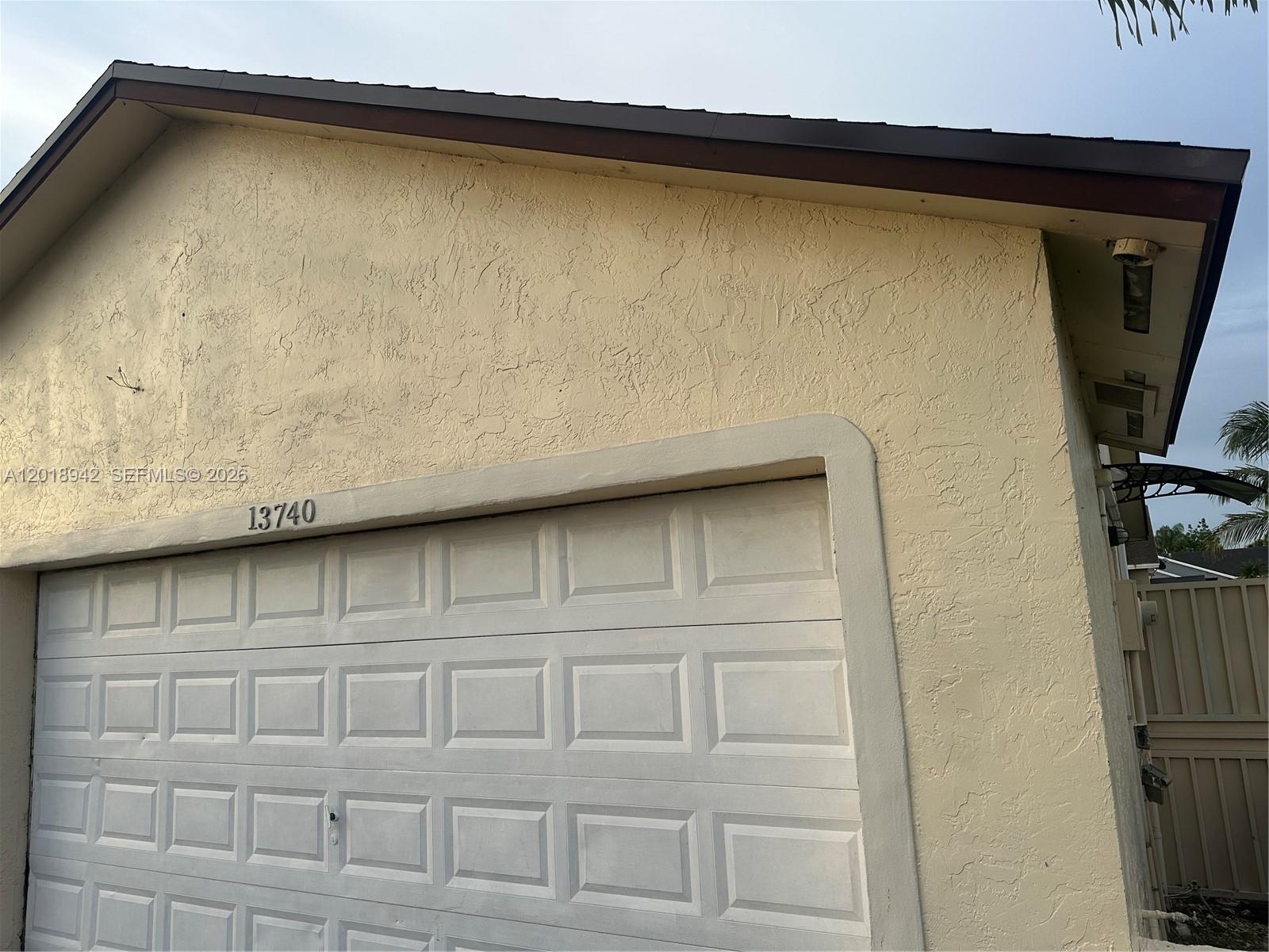 13740 Southwest 282nd Street, Unit 1 Homestead, FL 33033 - Photo 2 of 9 a view of a air conditioner