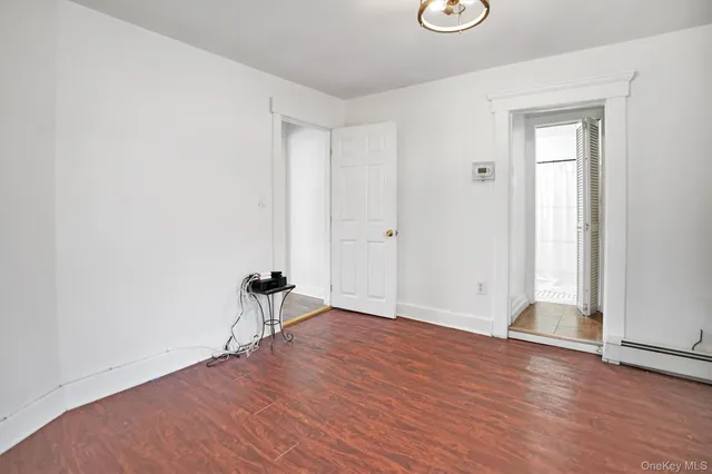 a bathroom with a sink a mirror and a shower curtain