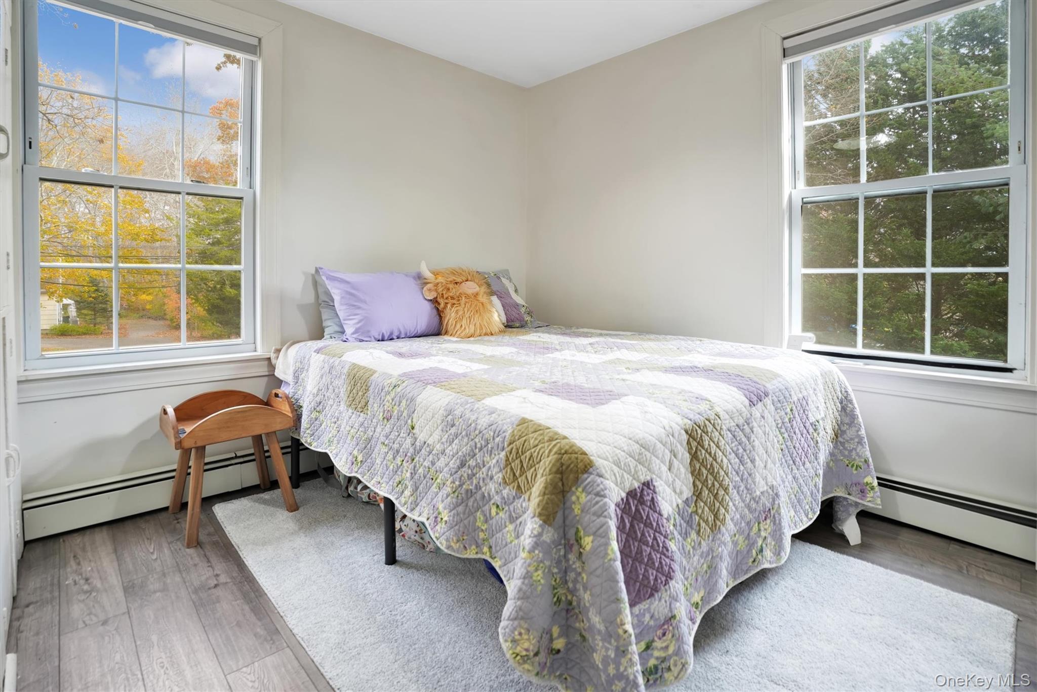 14 Halsey Avenue East Quogue, NY 11942 - Photo 15 of 23 a bedroom with a bed and a window