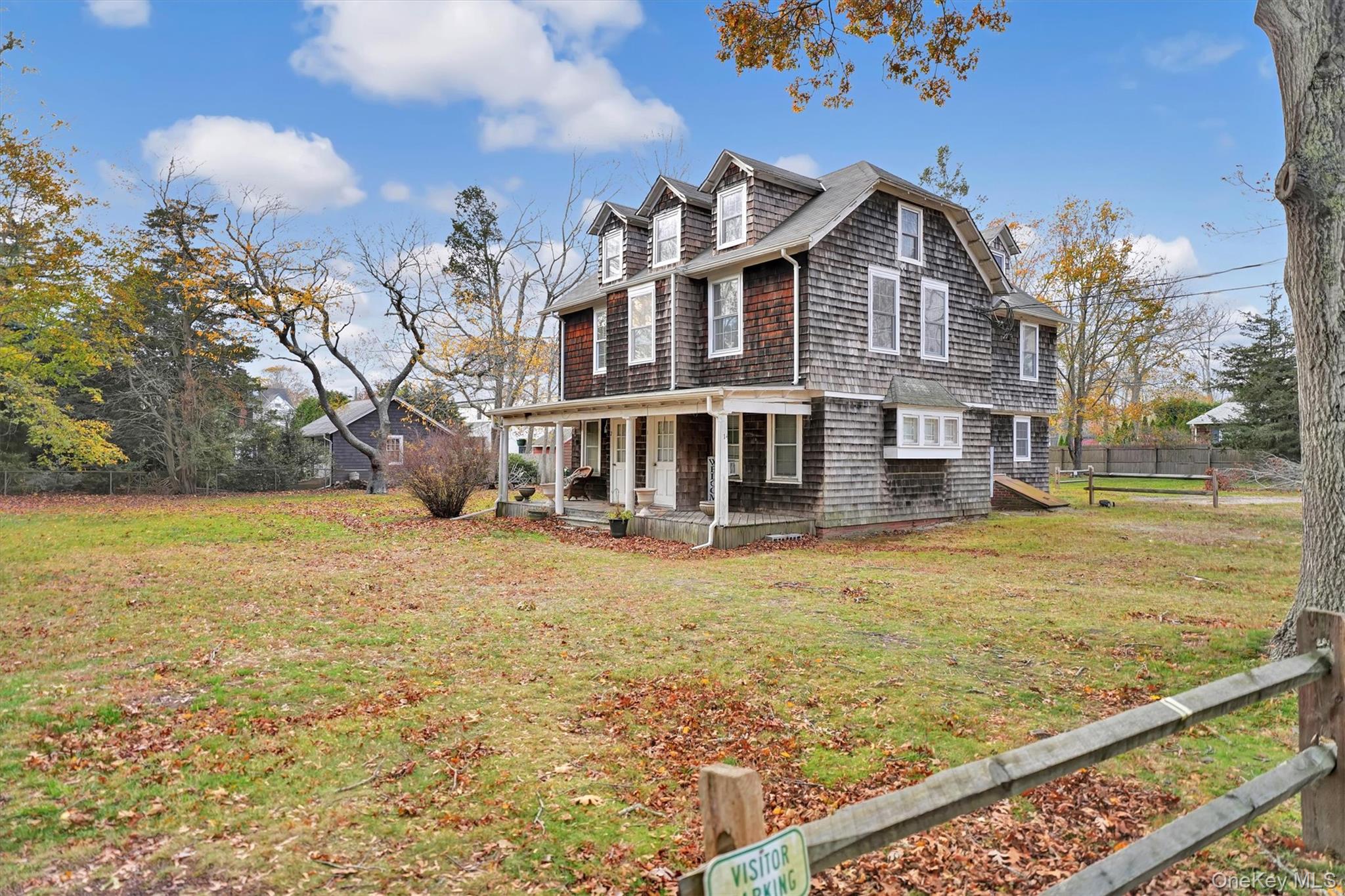 14 Halsey Avenue East Quogue, NY 11942 - Photo 3 of 23 a view of a house with a yard