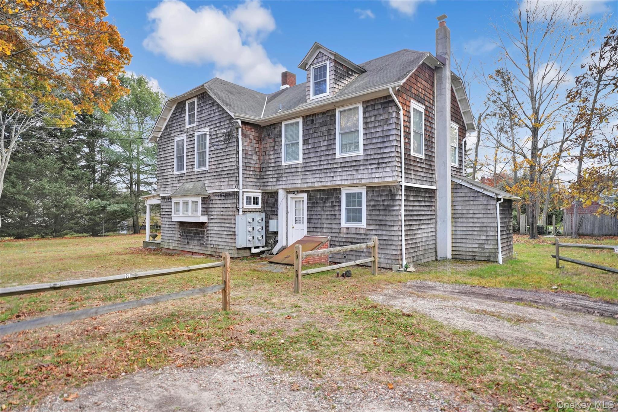 14 Halsey Avenue East Quogue, NY 11942 - Photo 5 of 23 a view of a house with a yard and sitting area