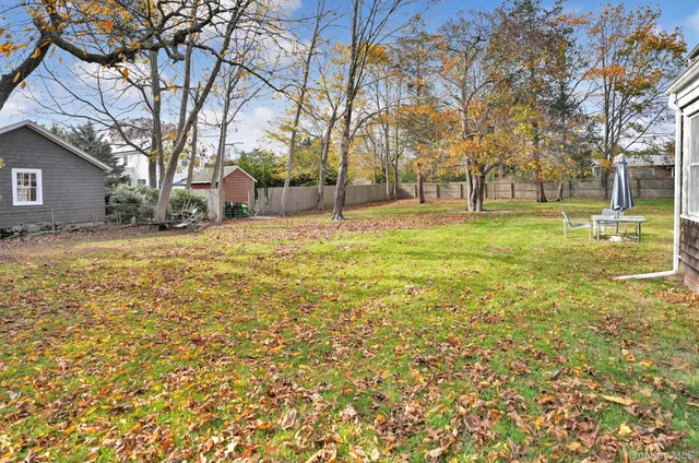 a view of a yard with a tree