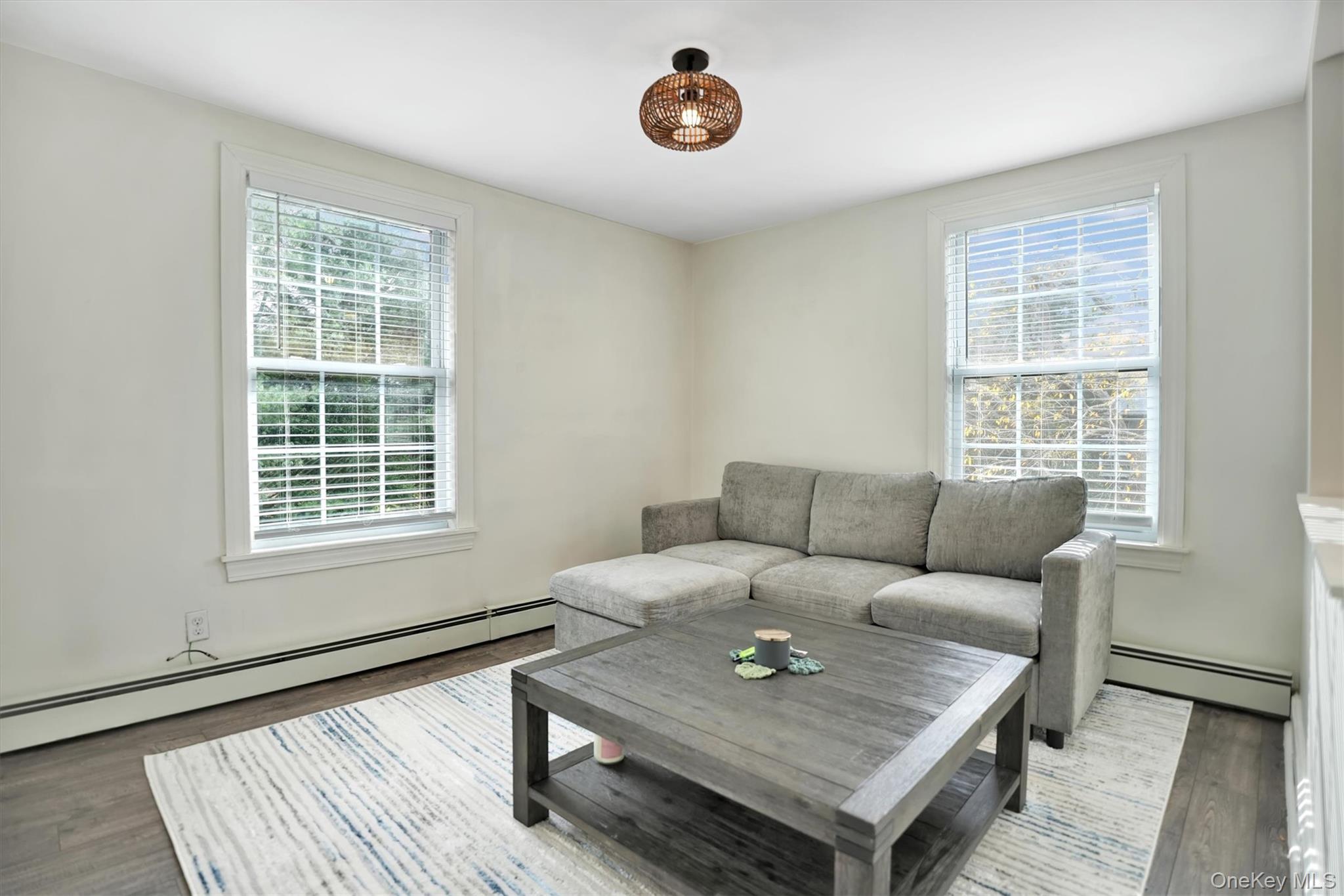 14 Halsey Avenue East Quogue, NY 11942 - Photo 10 of 23 a living room with furniture and a window