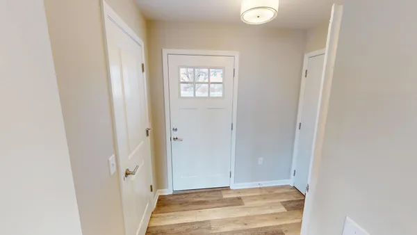 a view of entryway with wooden floor