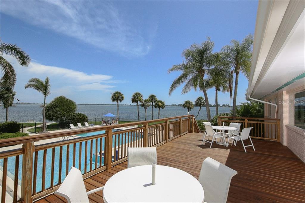 11000 Placida Road, Unit 1003 Placida, FL 33946 - Photo 29 of 41 Relax on the upper level deck overlooking heated pool & Intracoastal