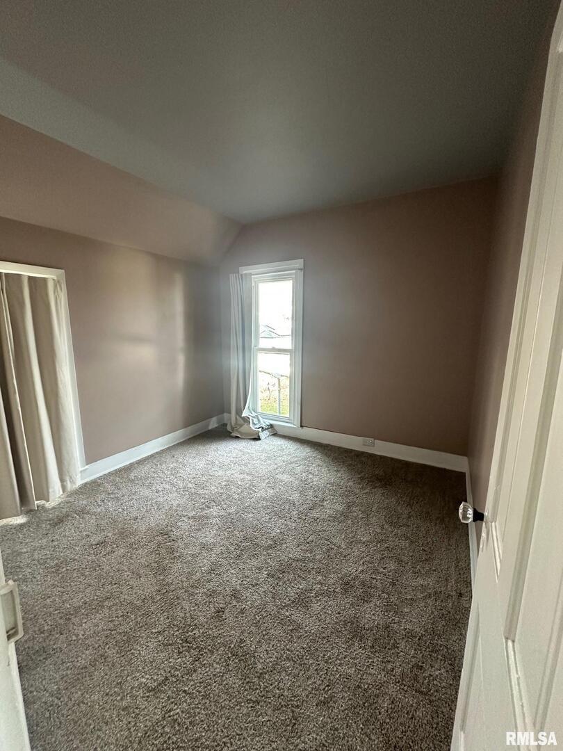 323 Lincoln Street Miles, IA 52064 - Photo 19 of 34 an empty room with windows