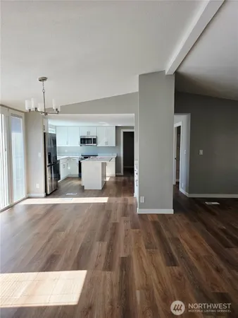 a view of a livingroom with wooden floor