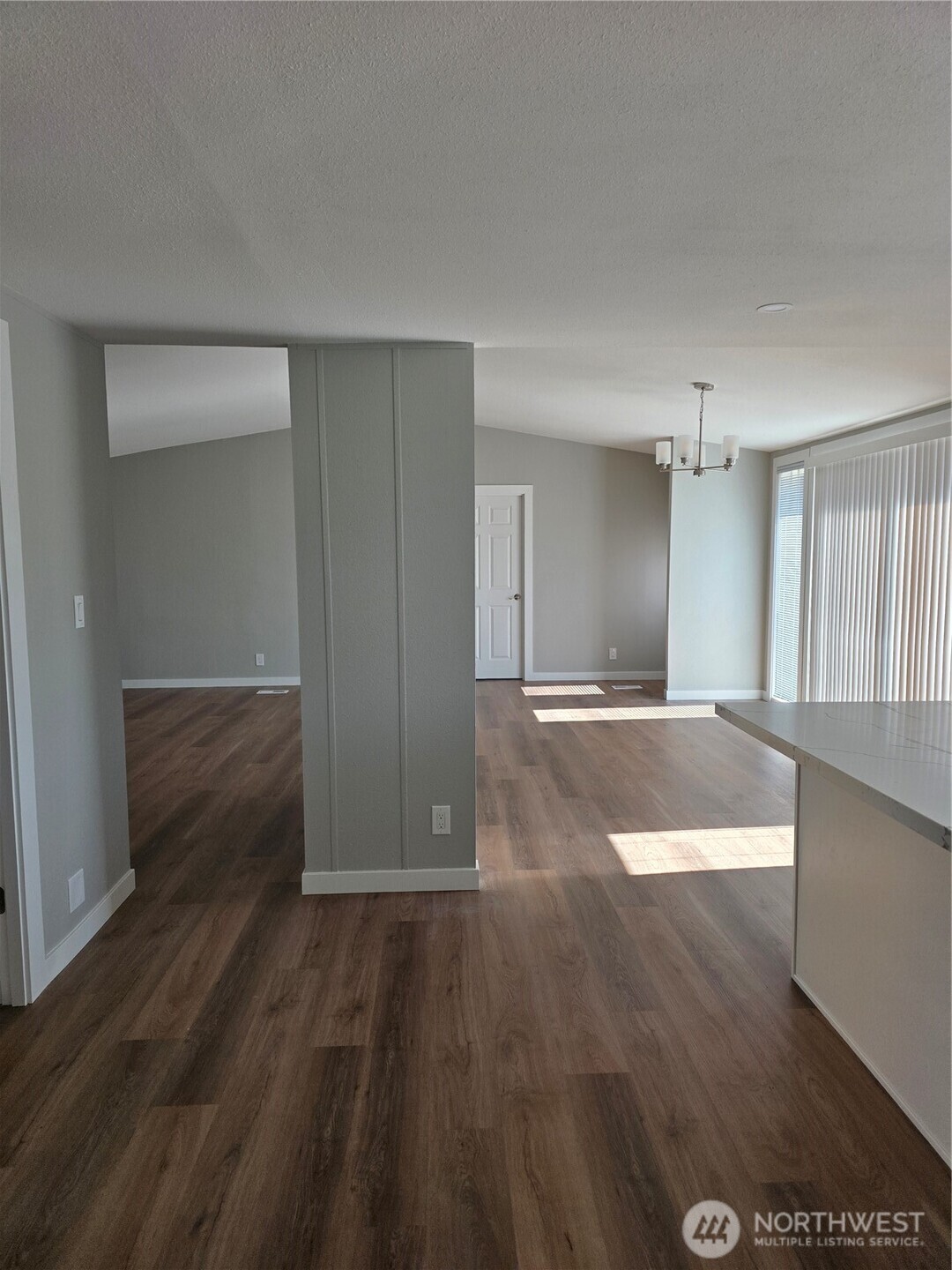 836 South Harmon Way, Unit 73 Orting, WA 98360 - Photo 18 of 30 a view of empty room with wooden floor