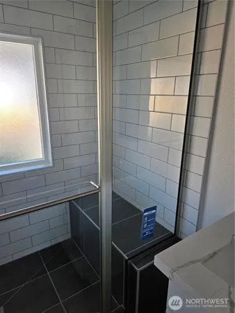 a bathroom with a sink a toilet and a shower