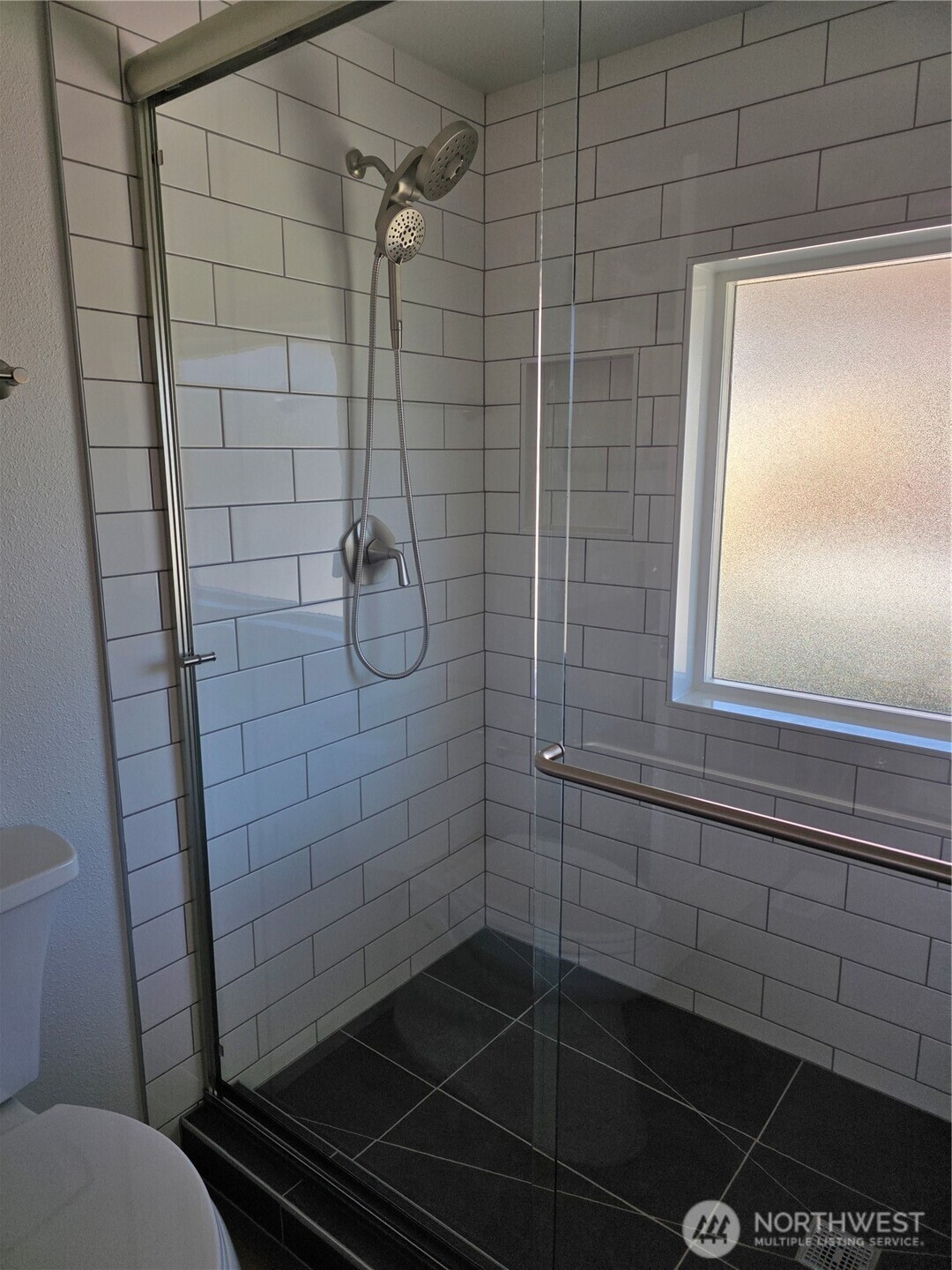 836 South Harmon Way, Unit 73 Orting, WA 98360 - Photo 22 of 30 a bathroom with a shower