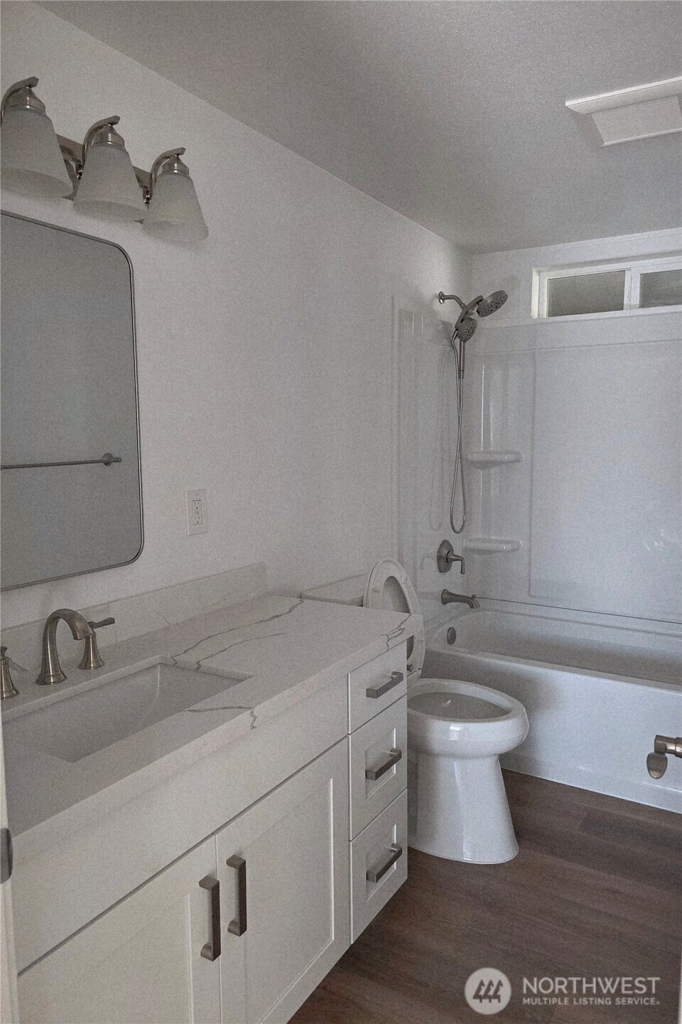 836 South Harmon Way, Unit 73 Orting, WA 98360 - Photo 28 of 30 a bathroom with a sink and a bathtub