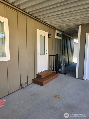 an empty room with wooden floor