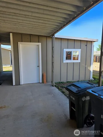 a lamp on a table with a window