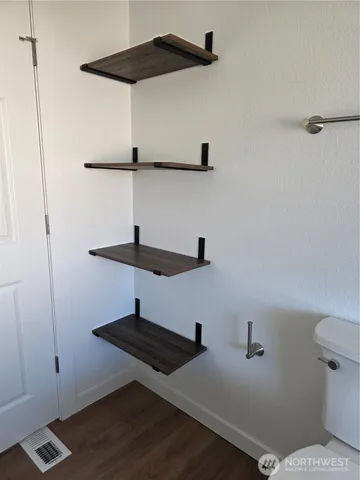 a kitchen with a refrigerator stove top oven and sink