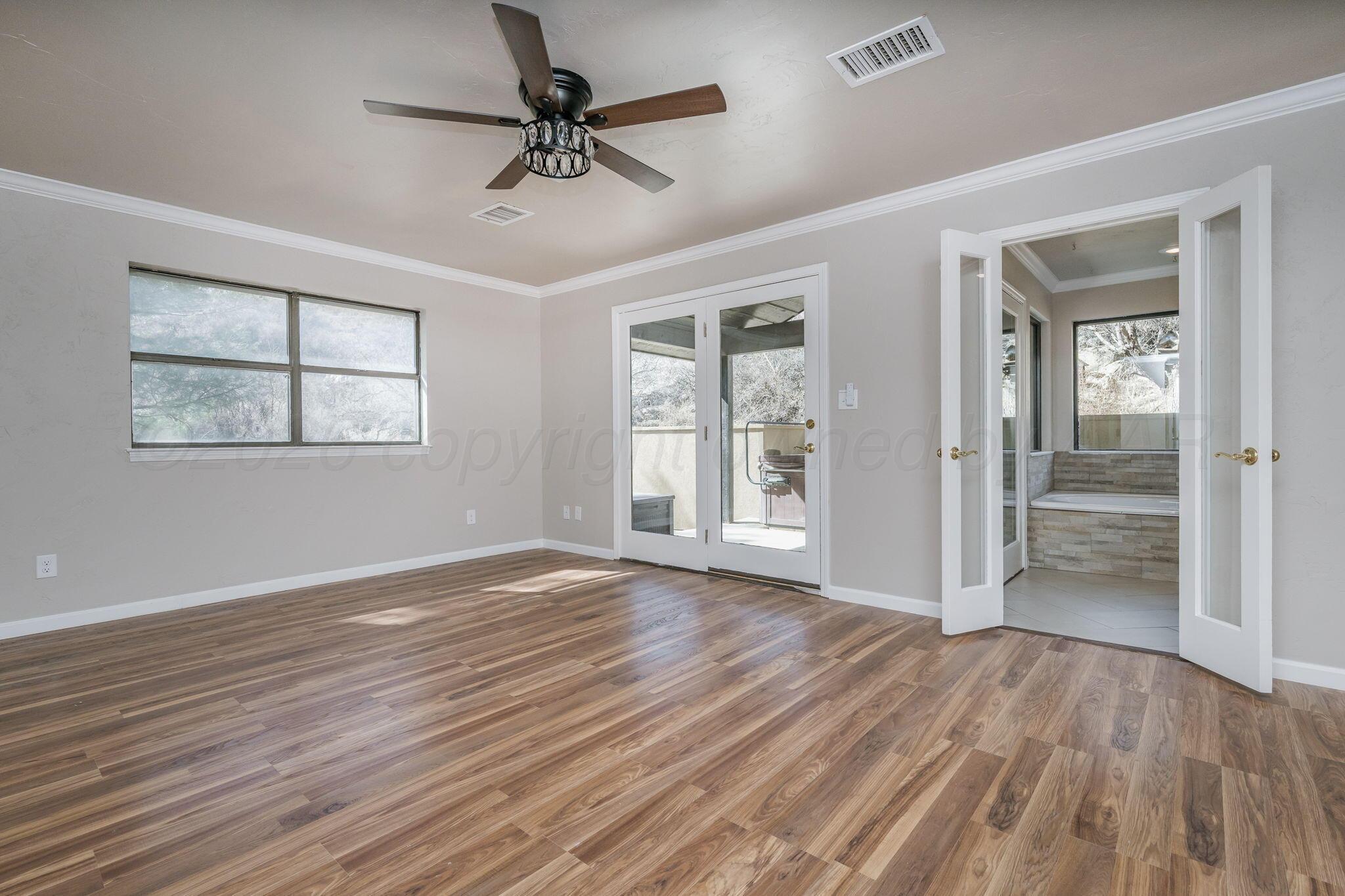 15 Lancaster Road Amarillo, TX 79124 - Photo 22 of 59 wooden floor in an empty room with a window