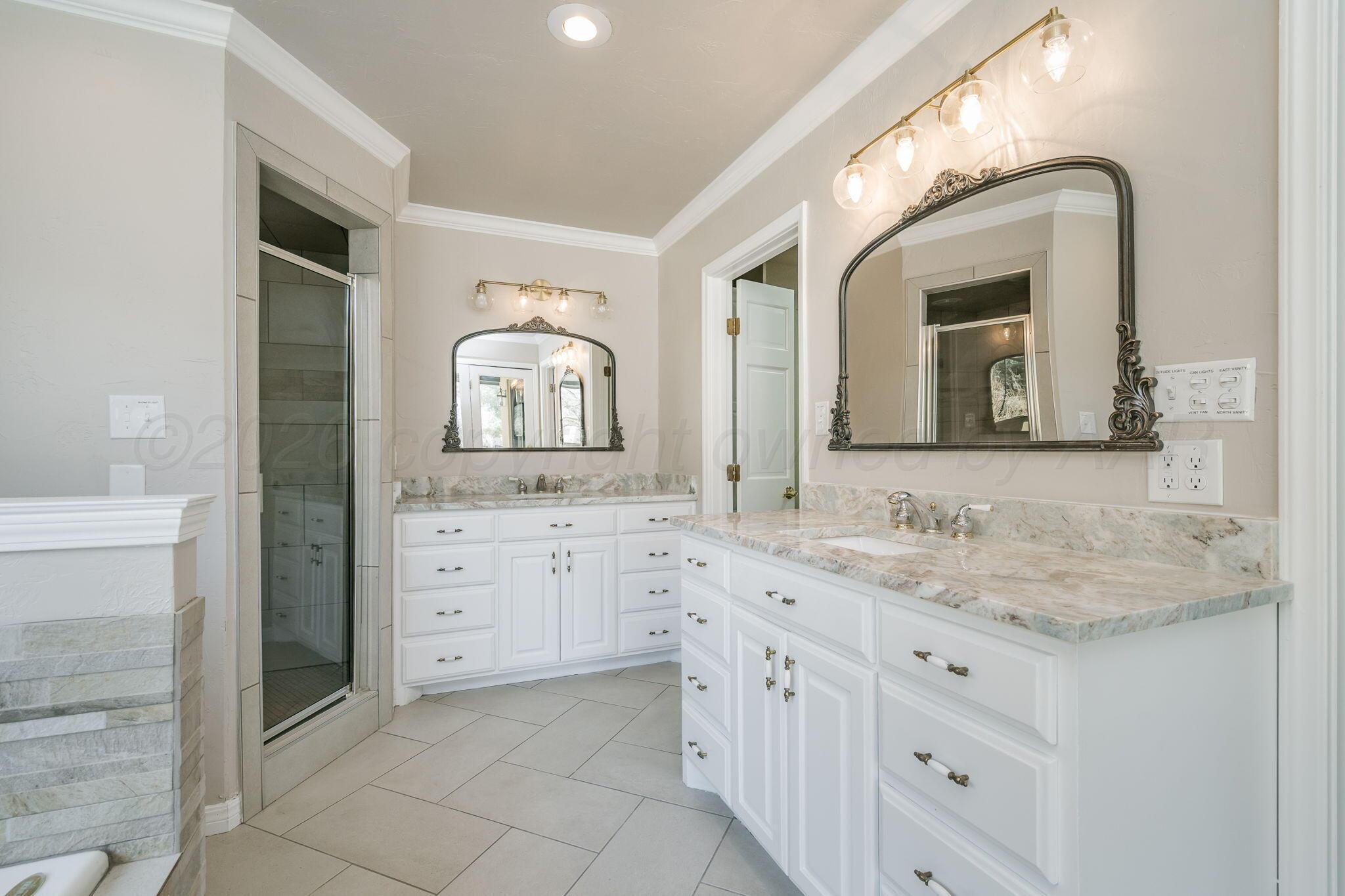 15 Lancaster Road Amarillo, TX 79124 - Photo 24 of 59 a bathroom with a double vanity sink and a mirror