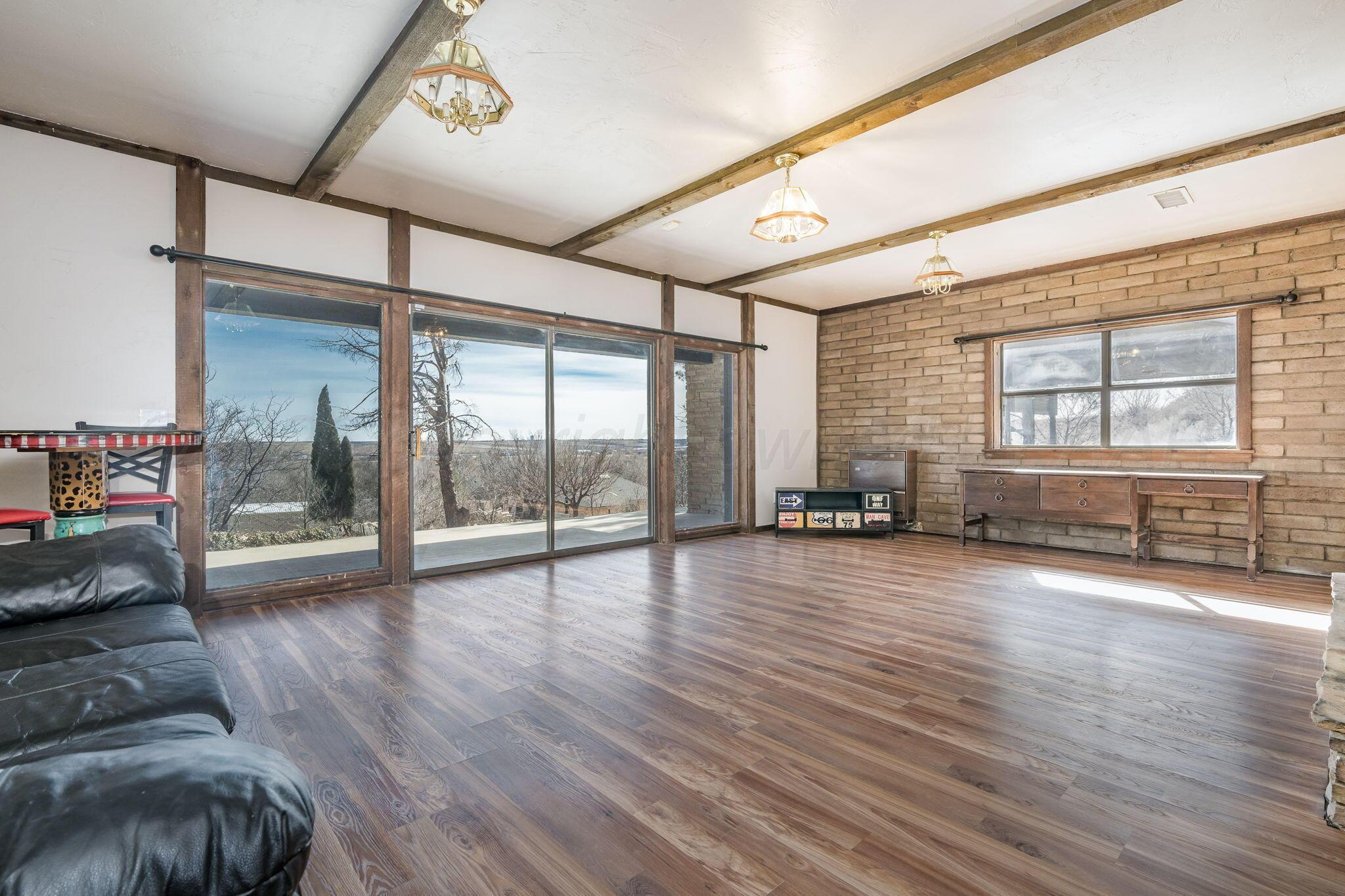 15 Lancaster Road Amarillo, TX 79124 - Photo 45 of 59 a view of an empty room with wooden floor and a window