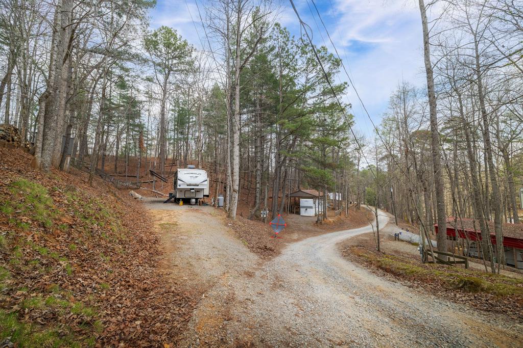 341 25th Street Ellijay, GA 30540 - Photo 14 of 15 a backyard of a house with table and chairs