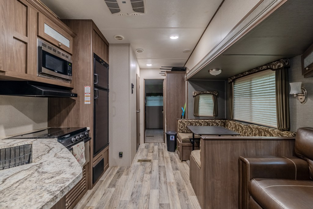 341 25th Street Ellijay, GA 30540 - Photo 2 of 15 a kitchen with stainless steel appliances granite countertop a stove and a refrigerator