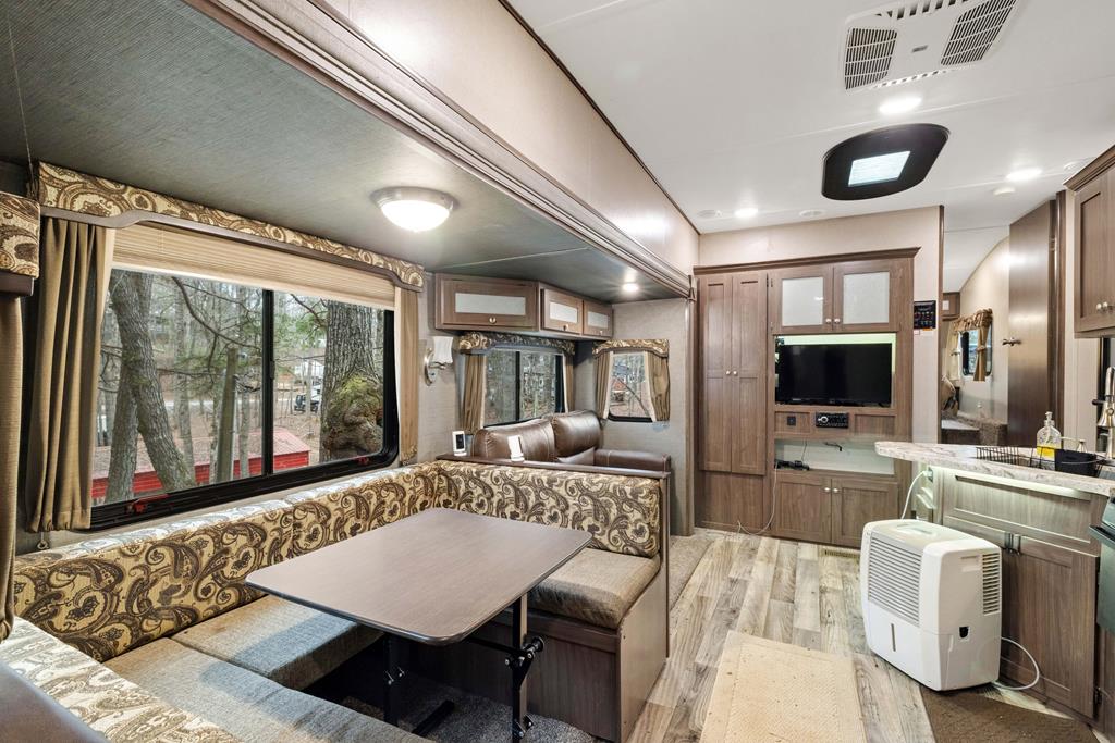 341 25th Street Ellijay, GA 30540 - Photo 5 of 15 a living room with furniture and a flat screen tv