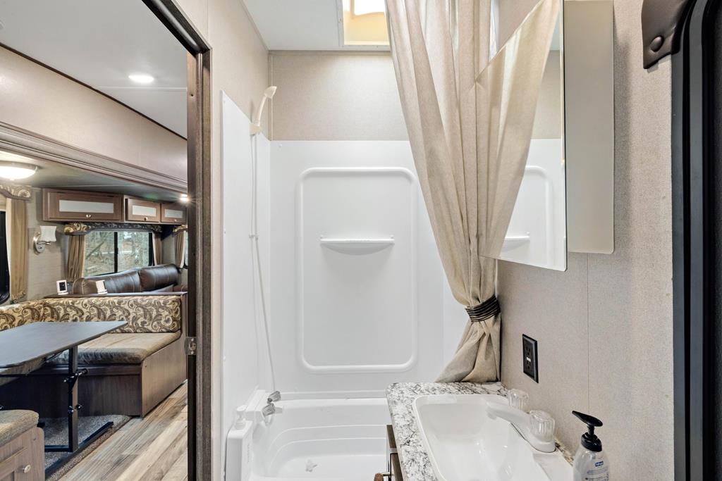 341 25th Street Ellijay, GA 30540 - Photo 8 of 15 a bathroom with a sink toilet and tub