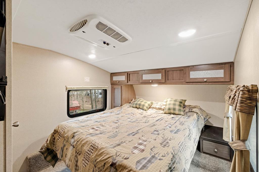 341 25th Street Ellijay, GA 30540 - Photo 9 of 15 a bedroom with a bed and wooden floor