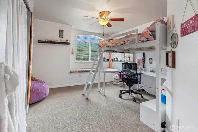 a view of a room with workspace and windows