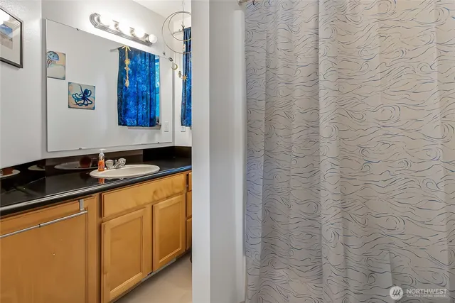 a bathroom with a sink and a mirror