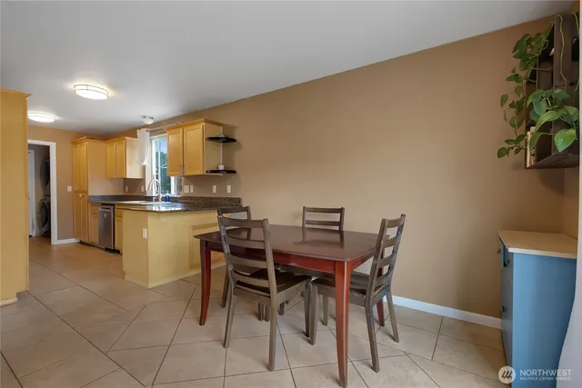 a kitchen with a table and chairs in it