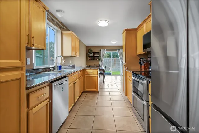 a large kitchen with a large window