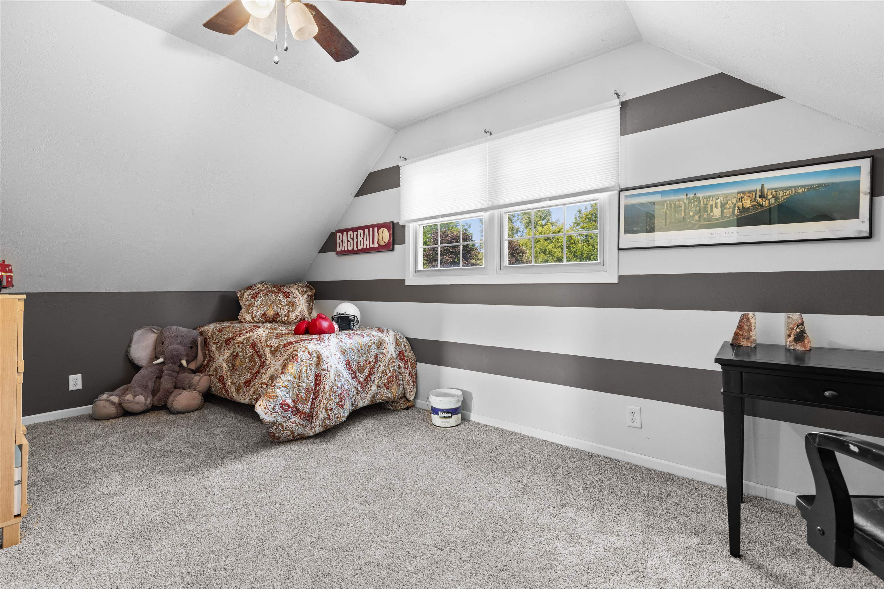 4830 Crown Point Circle Roscoe, IL 61073 - Photo 11 of 24 a bedroom with a bed and a chandelier