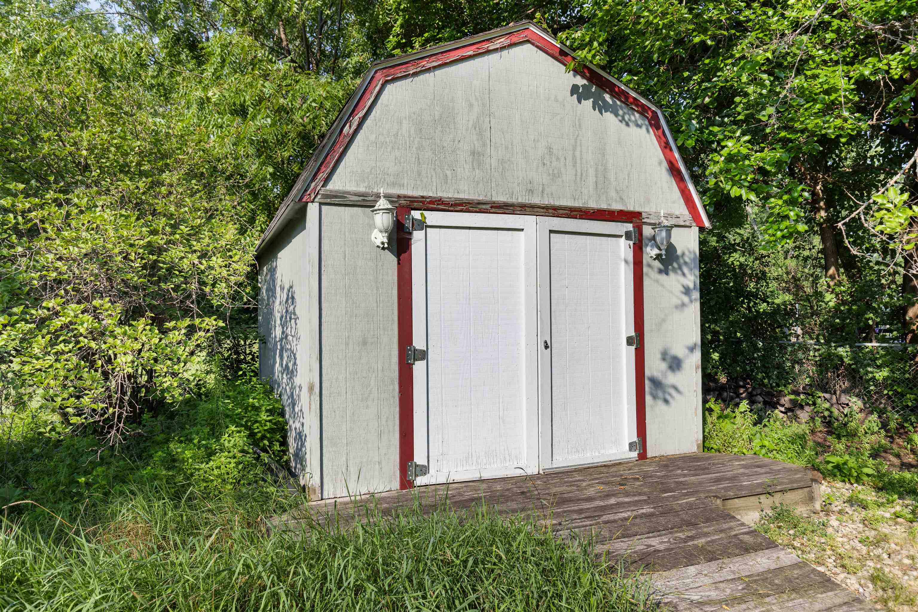 4830 Crown Point Circle Roscoe, IL 61073 - Photo 22 of 24 a view of small house with a small yard plants and large trees