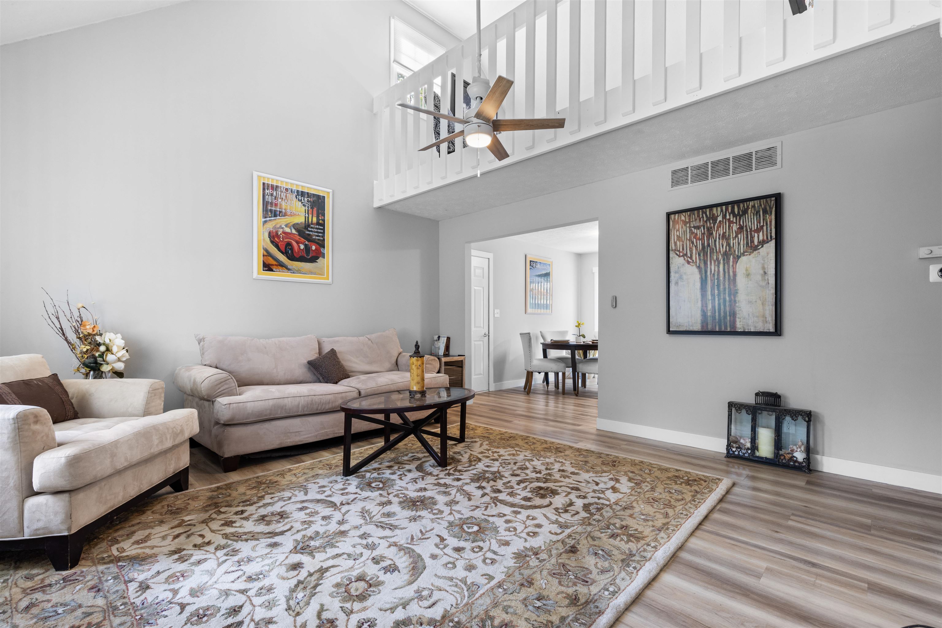 4830 Crown Point Circle Roscoe, IL 61073 - Photo 3 of 24 a living room with furniture or couch and a wooden floor