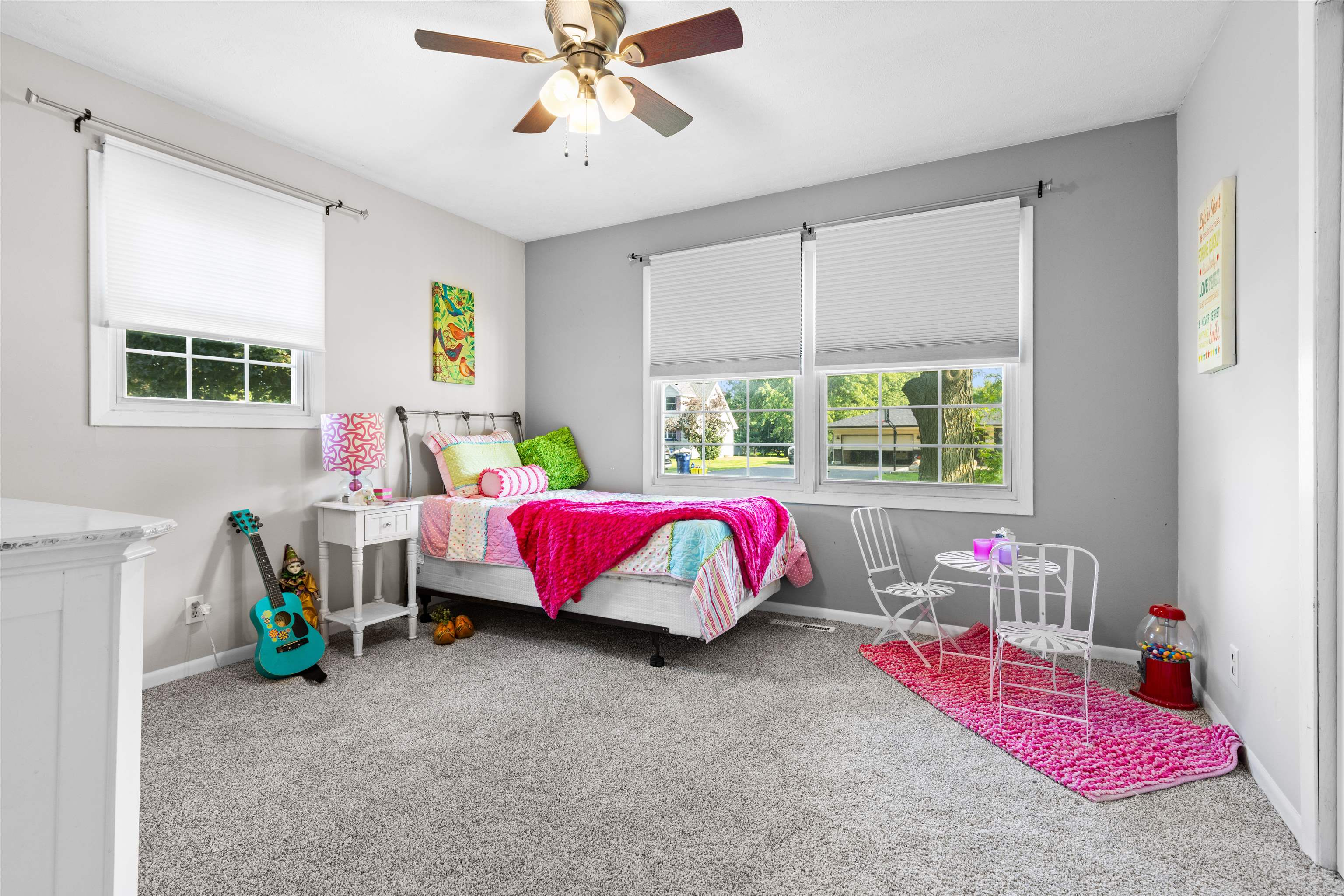 4830 Crown Point Circle Roscoe, IL 61073 - Photo 8 of 24 a bed room with a bed window and a chandelier
